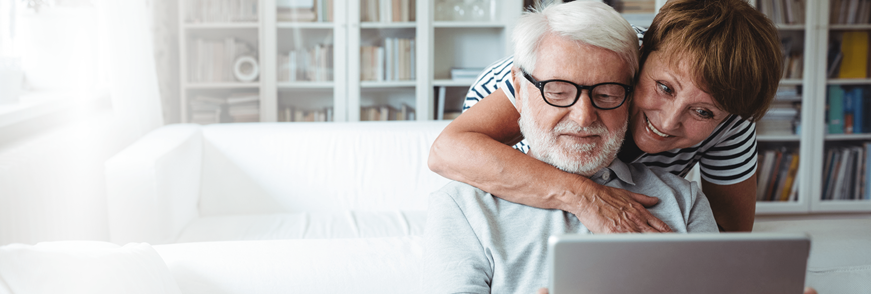 Senior couple looking at computer together